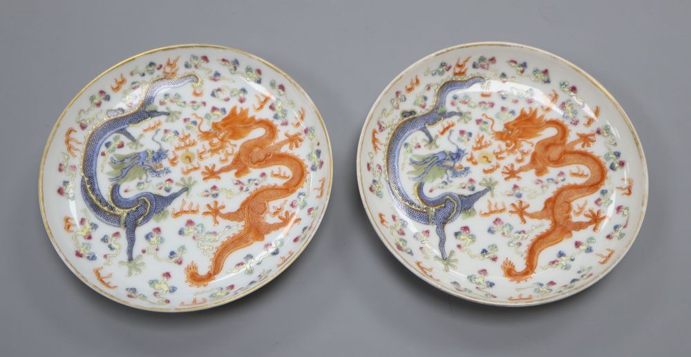 A pair of Chinese enamelled porcelain dragon saucer dishes, diameter 13cm